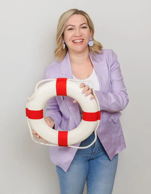 Carly from Hatched Designs holding a lifebuoy, ready to help with your broken WordPress website